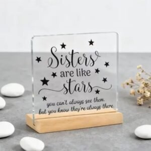 Sisters Are Like Stars Gift plaque on wooden stand front view.